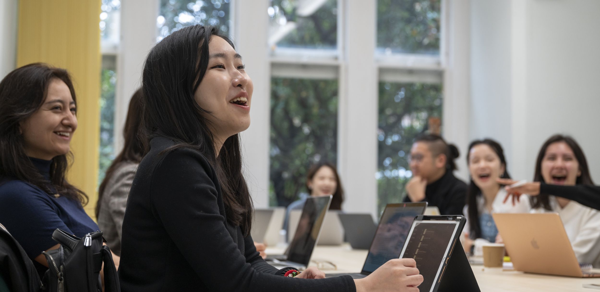 Students in a seminar laughing